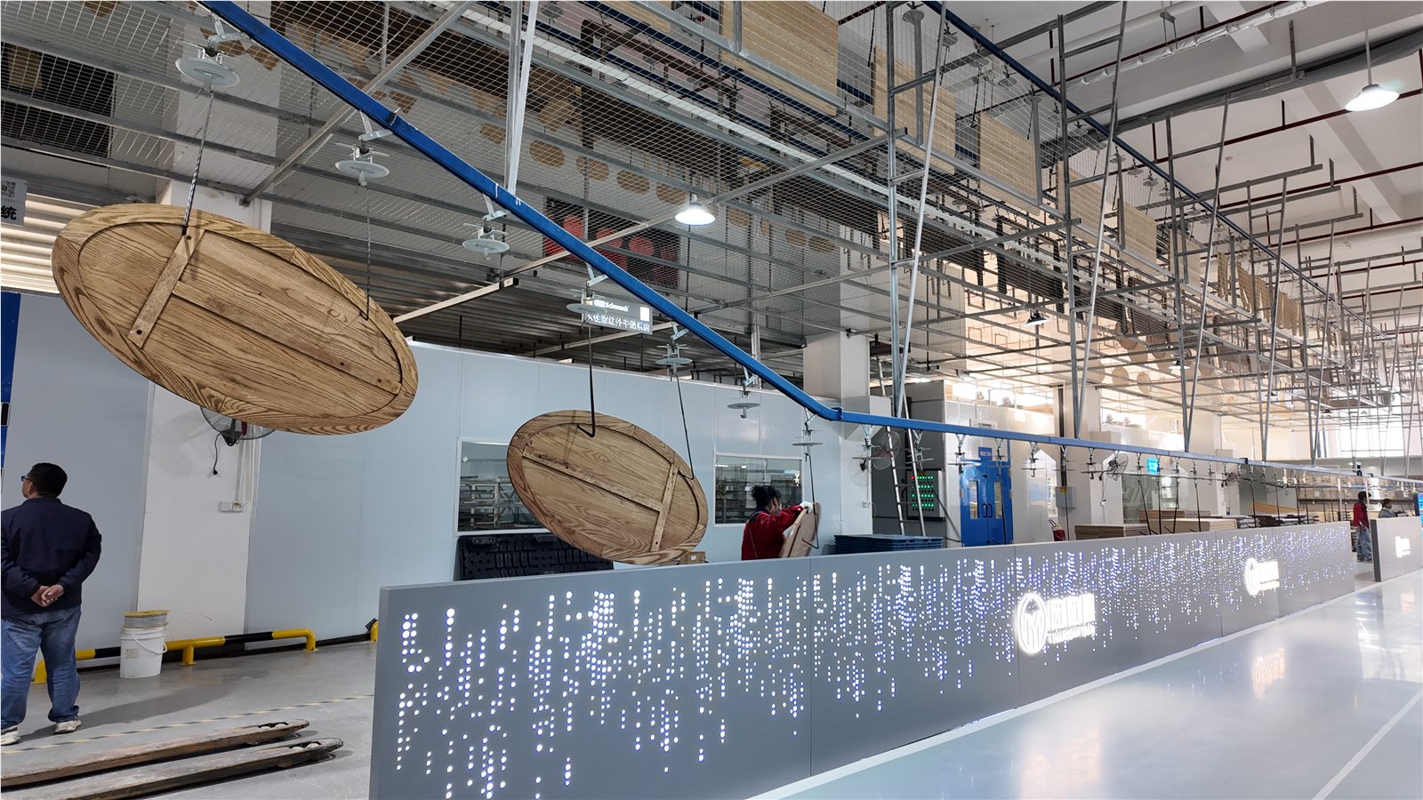 Furniture components moving through the finishing line